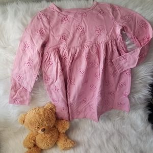 This cute pink cat print long sleeve dress for a young girl